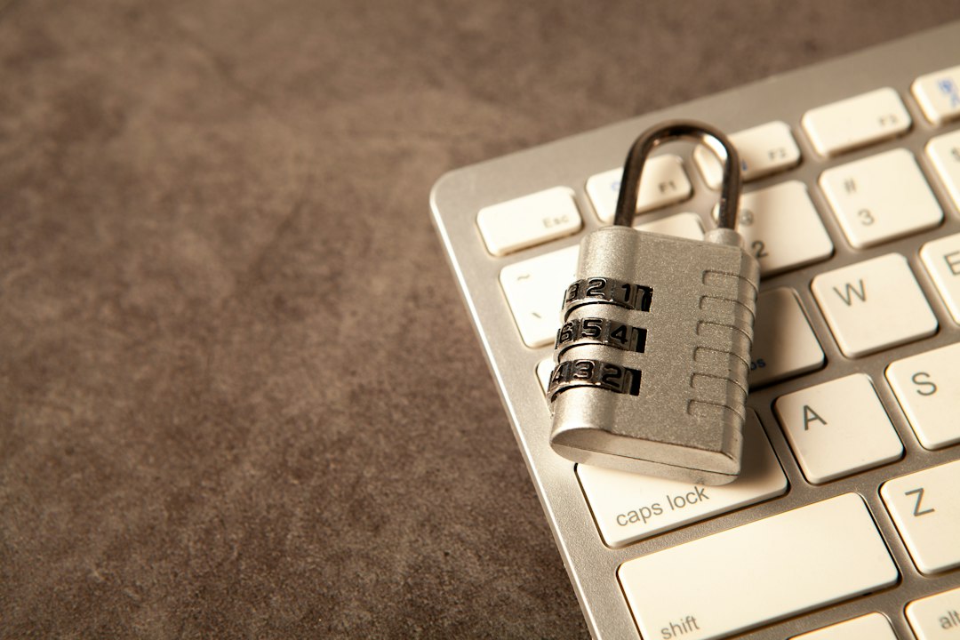 Locked padlock resting on a computer keyboard