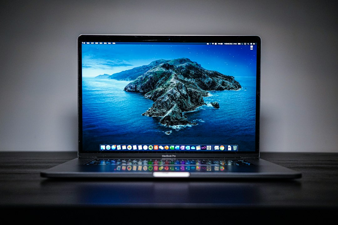 Open laptop, representing checking the AppxDeployment-Server log to find which package is in use