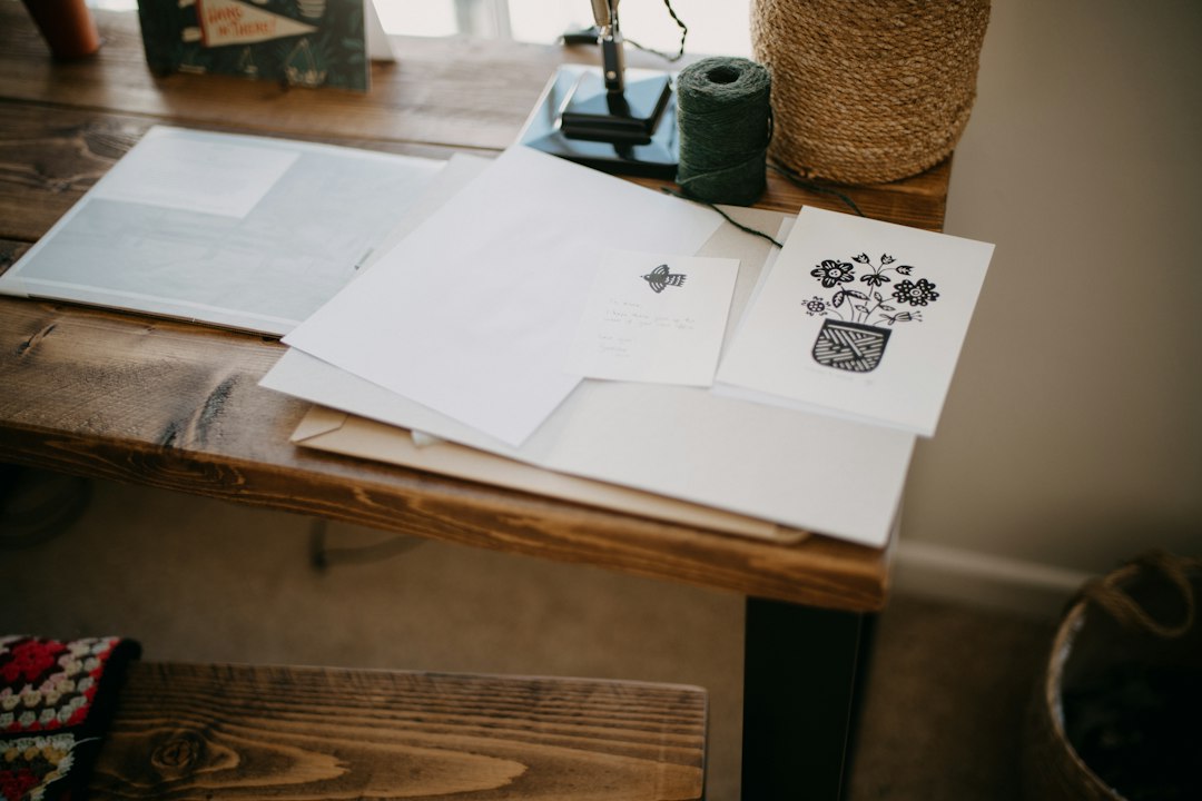 Printed pages on a table, a reminder to clear stuck print jobs from the spooler