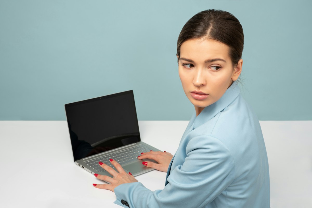 Employee working on a laptop after device registration with Microsoft Entra ID succeeded