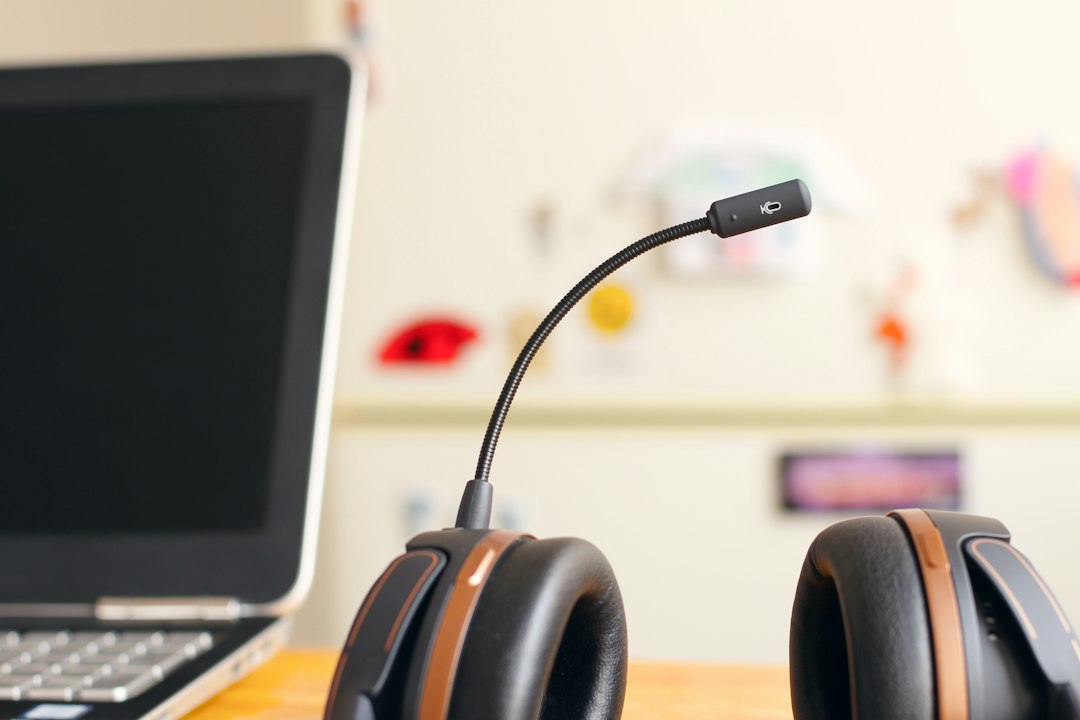 Headset next to a laptop, representing the Discord No Route voice connection error