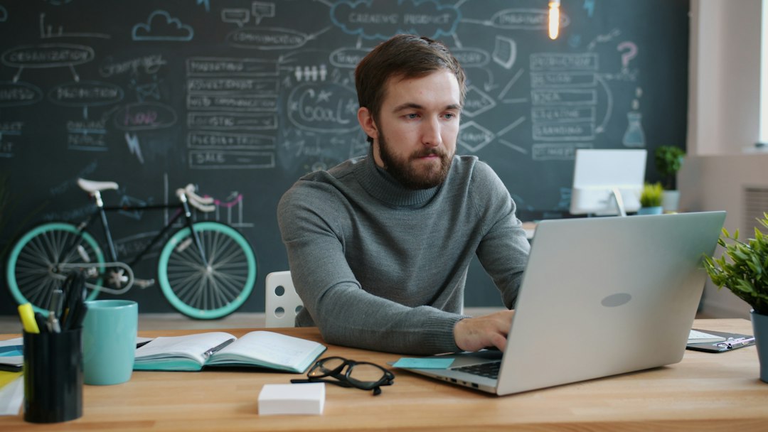 Person typing on a laptop, entering commands to rebuild Windows boot files