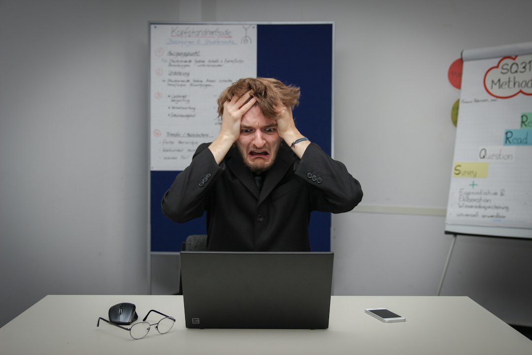 Person using a laptop to open Windows recovery options and change startup settings