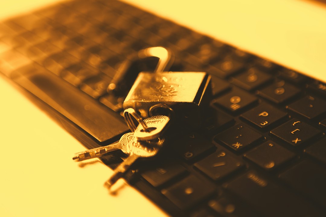 Key resting on a laptop keyboard, representing finding the BitLocker recovery key in a Microsoft account