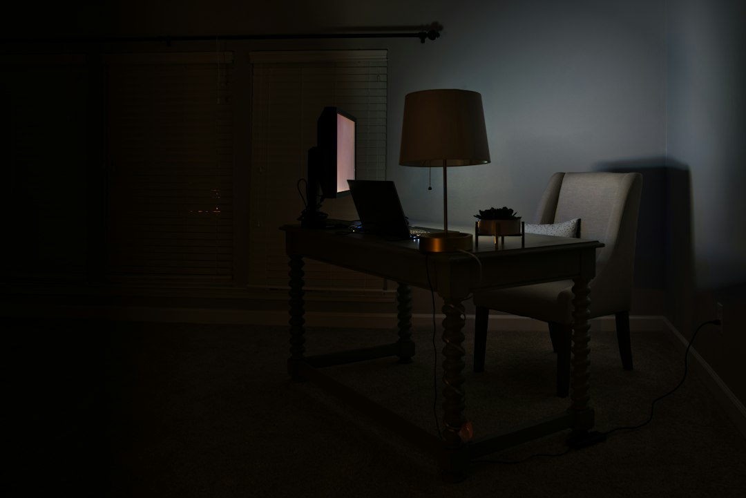 Computers on a desk at night, waiting on the Getting Windows ready screen