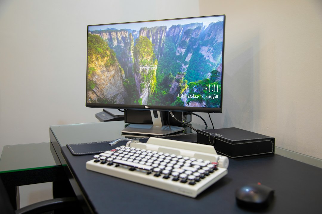 Home office desk with a monitor and a multifunction printer, ready to install the HP Envy 4500 driver