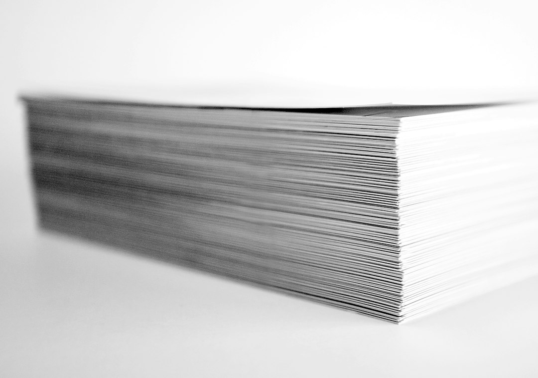 Stack of printed pages, representing a document with several sections and different headers