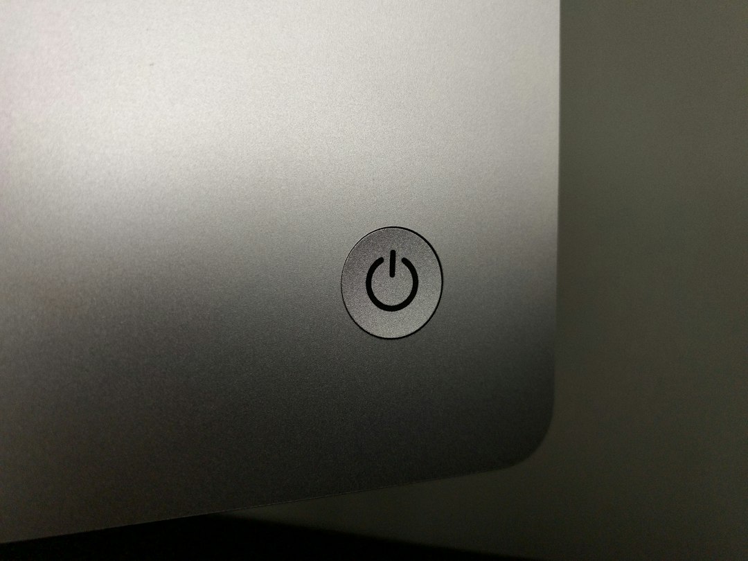 Close-up of a computer power button, representing how to disable Fast Startup in Windows