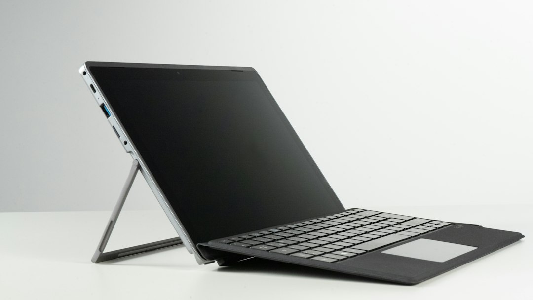 Laptop with a dark screen, representing installing open-vm-tools in a Linux virtual machine