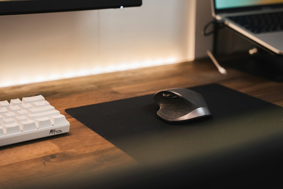 Computer mouse and keyboard on a desk, representing a Windows mouse that moves but won't click