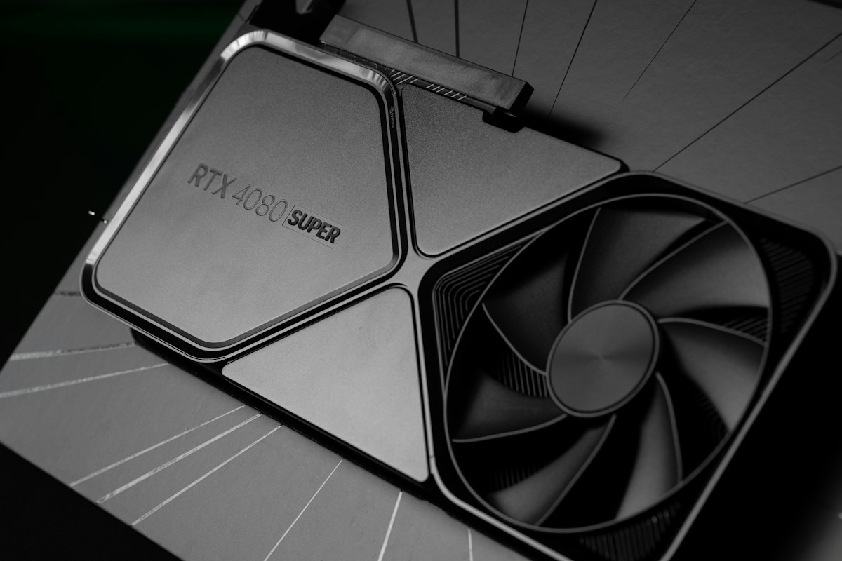 Close-up of a graphics card fan inside a gaming PC, whose 3D and display settings now live in the NVIDIA App