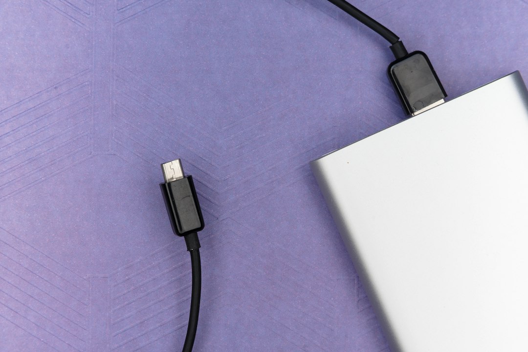 Charging cable connected to a laptop that shows plugged in, not charging in Windows 10