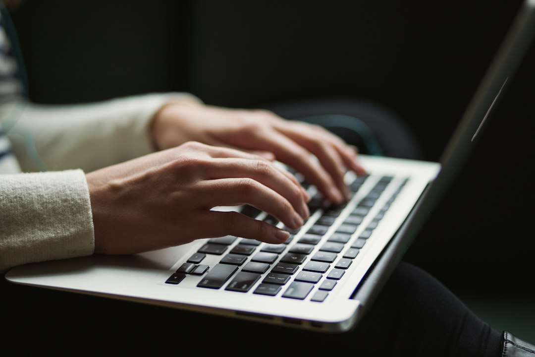Laptop on a desk, used to rename a local account in Windows 10 through Control Panel or netplwiz