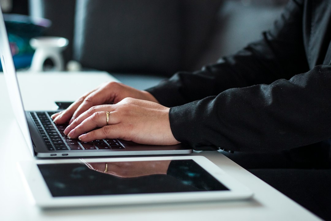 Man working on a laptop, repairing Office so Word activates again