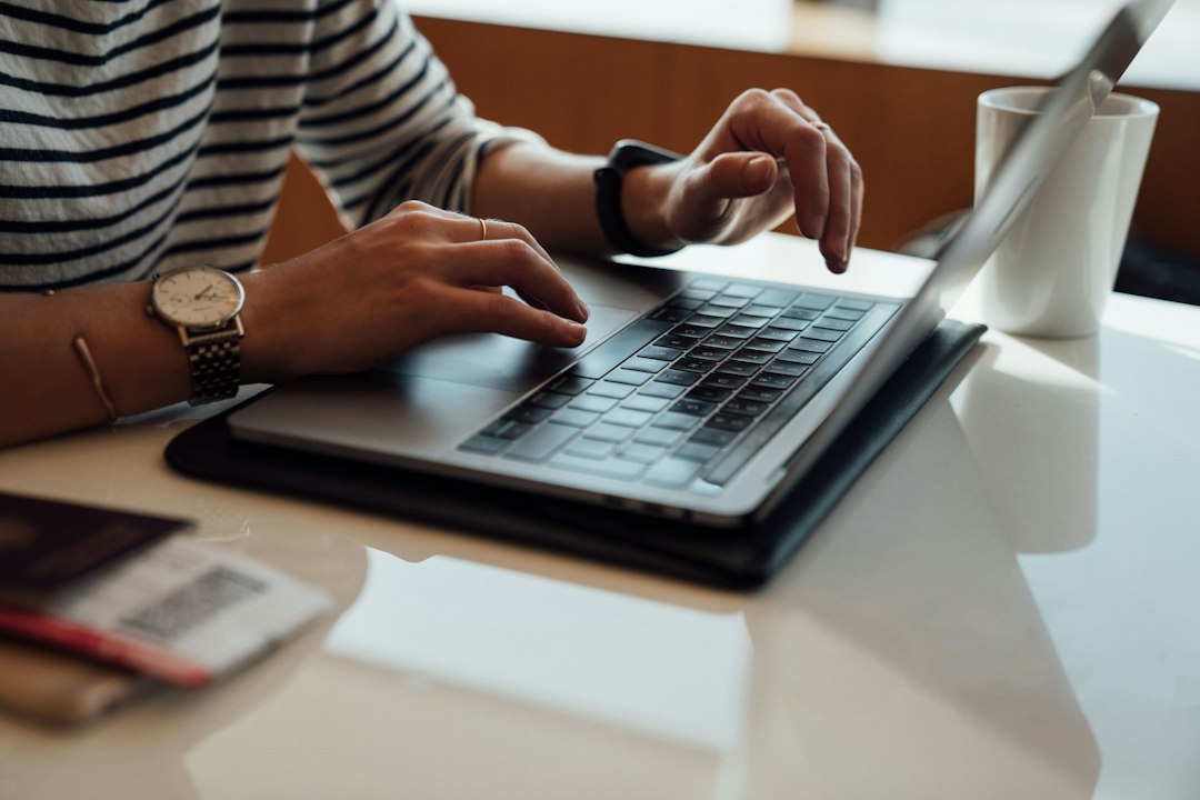 Person at a laptop repairing Windows system files after the search box stopped accepting typing