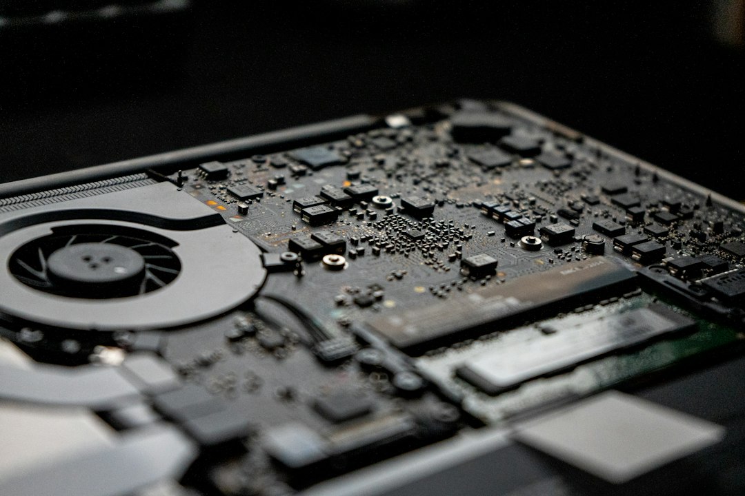Close-up of a PC motherboard and cooling fan inside a Windows computer