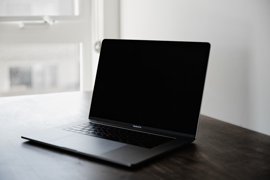 Laptop on a table, representing resetting the OneDrive app on Windows to fix sign-in errors