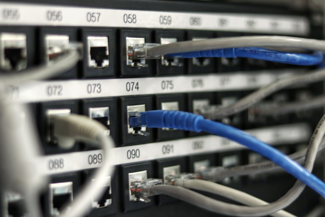 Network switch with cables, representing restarting the router to fix Discord No Route