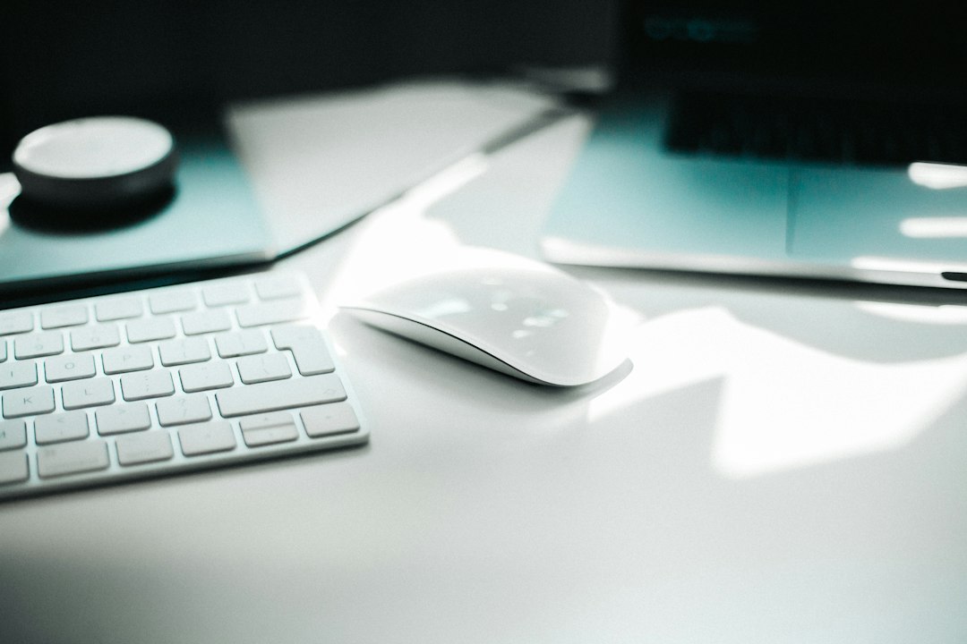 Wireless mouse beside a keyboard, representing testing the mouse, batteries and USB port