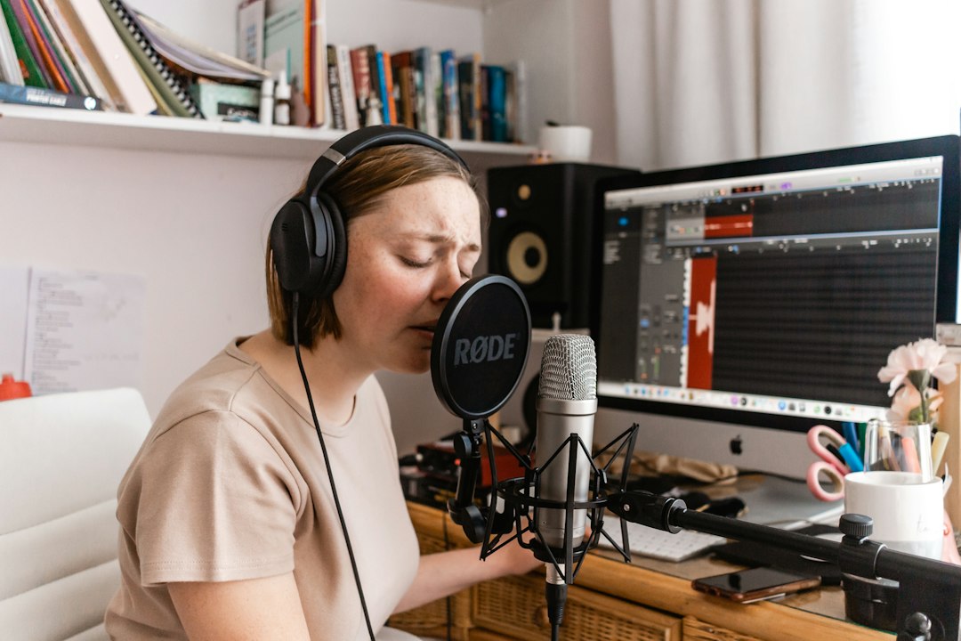 Home recording setup with a microphone and computer, representing fixing Stereo Mix not showing in Windows