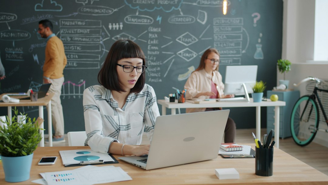 Laptop user checking Teams settings when spell check is not working