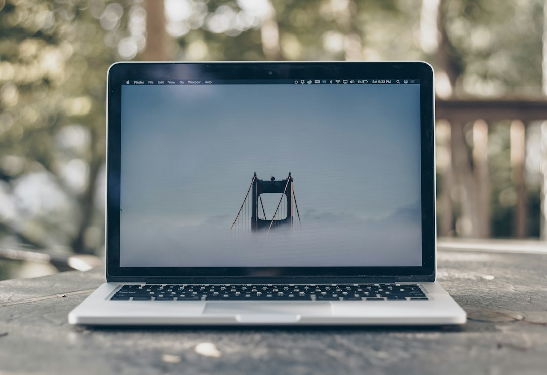 Laptop on a desk waiting for a Windows app to open