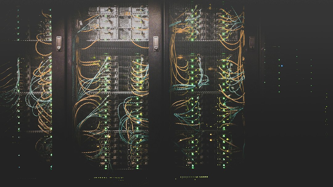 Network cables plugged into a server rack holding shared drives
