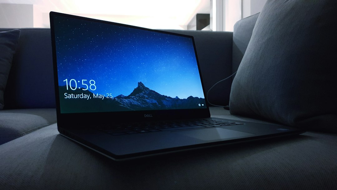 Laptop on a sofa, representing turning on logon auditing so Windows records sign-ins