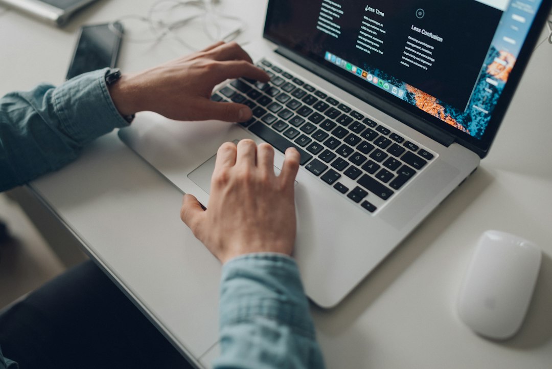 Person working on a laptop after upgrading to Windows Pro, with features such as BitLocker and Remote Desktop