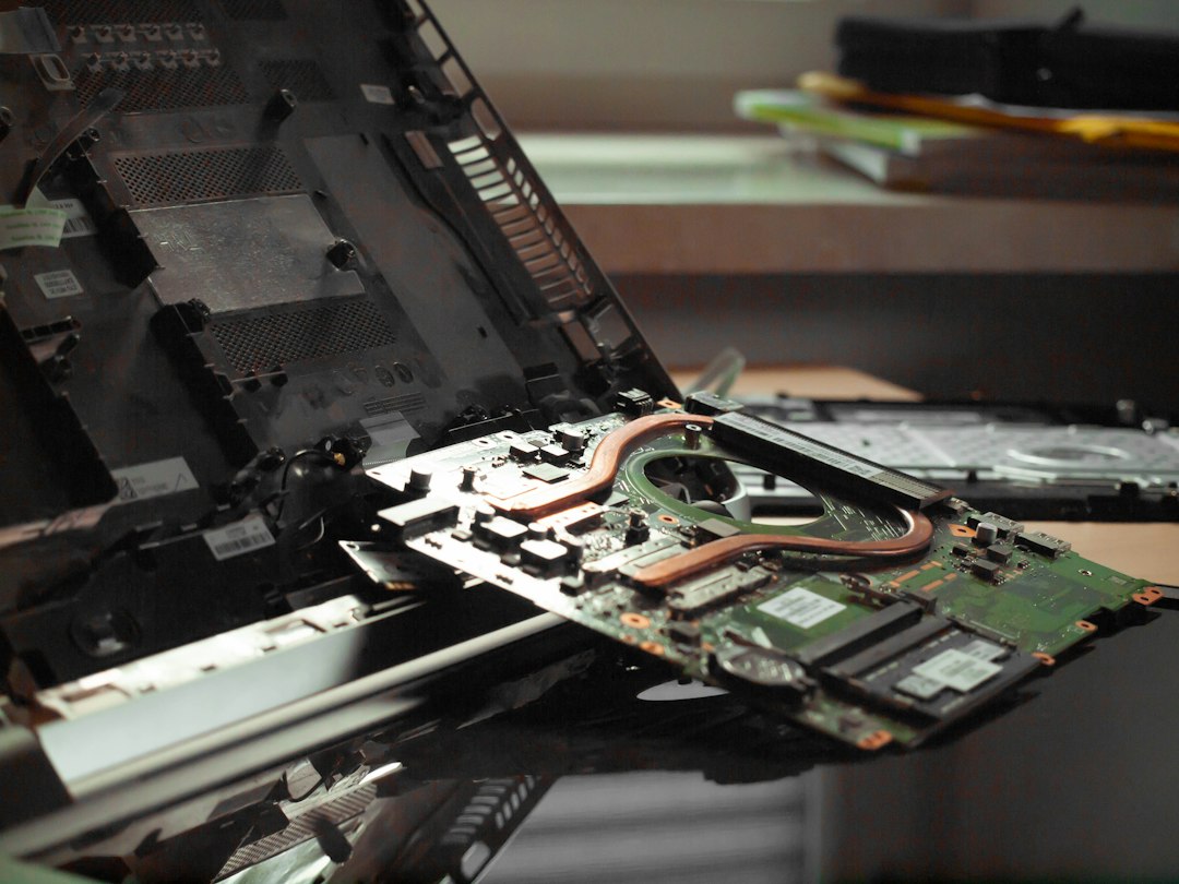 Open laptop on a desk, ready to run System File Checker in Command Prompt