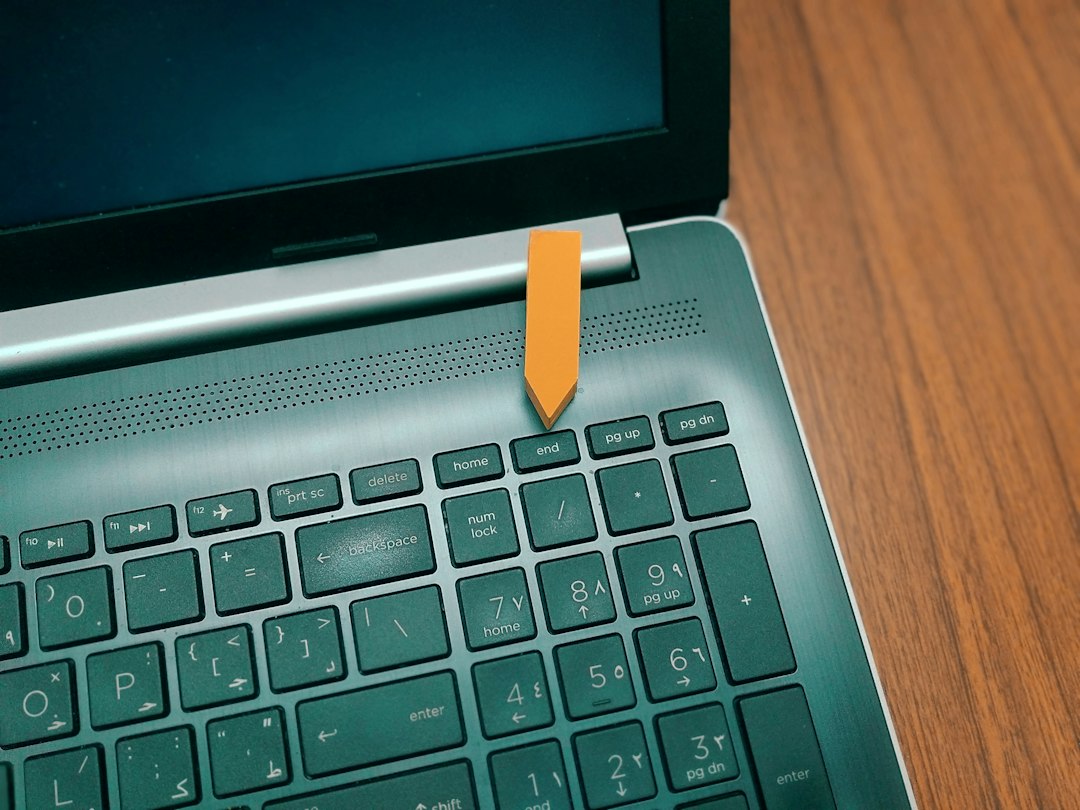 Windows laptop on a desk, ready to be shut down from the Start menu power options