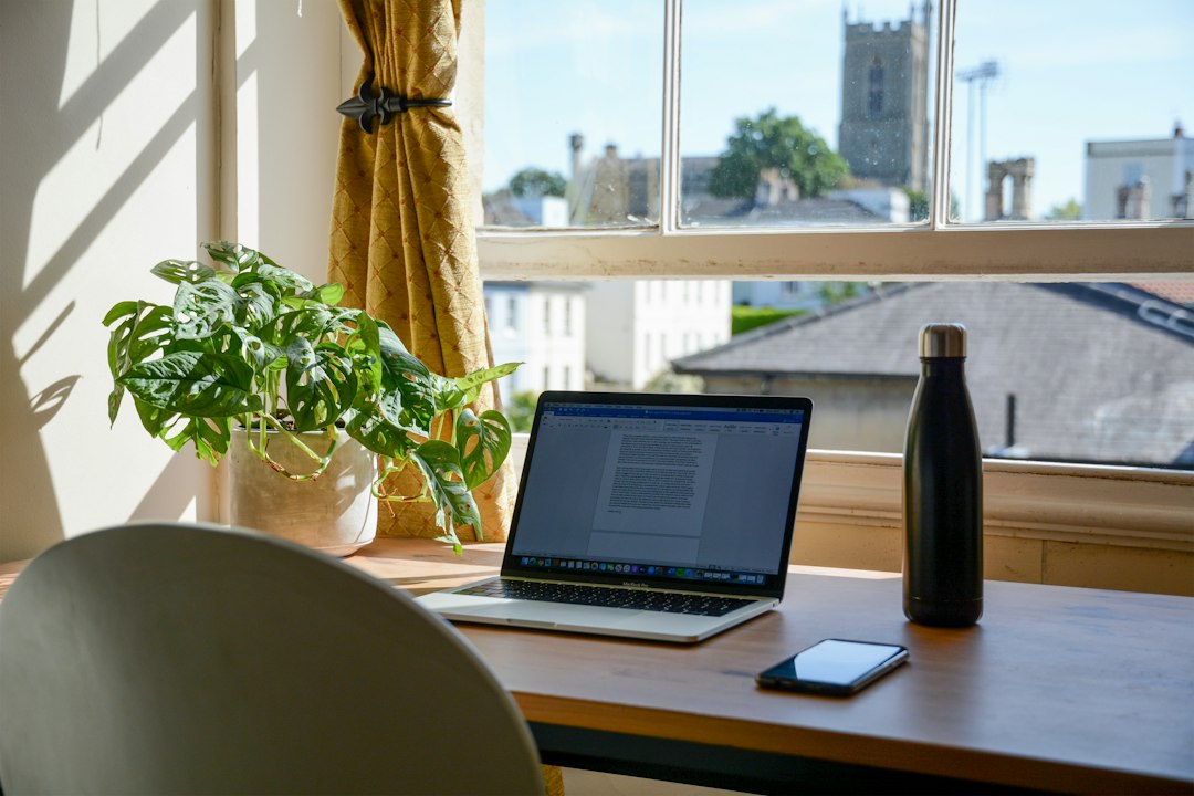 Laptop on a home desk used for both work and personal tasks