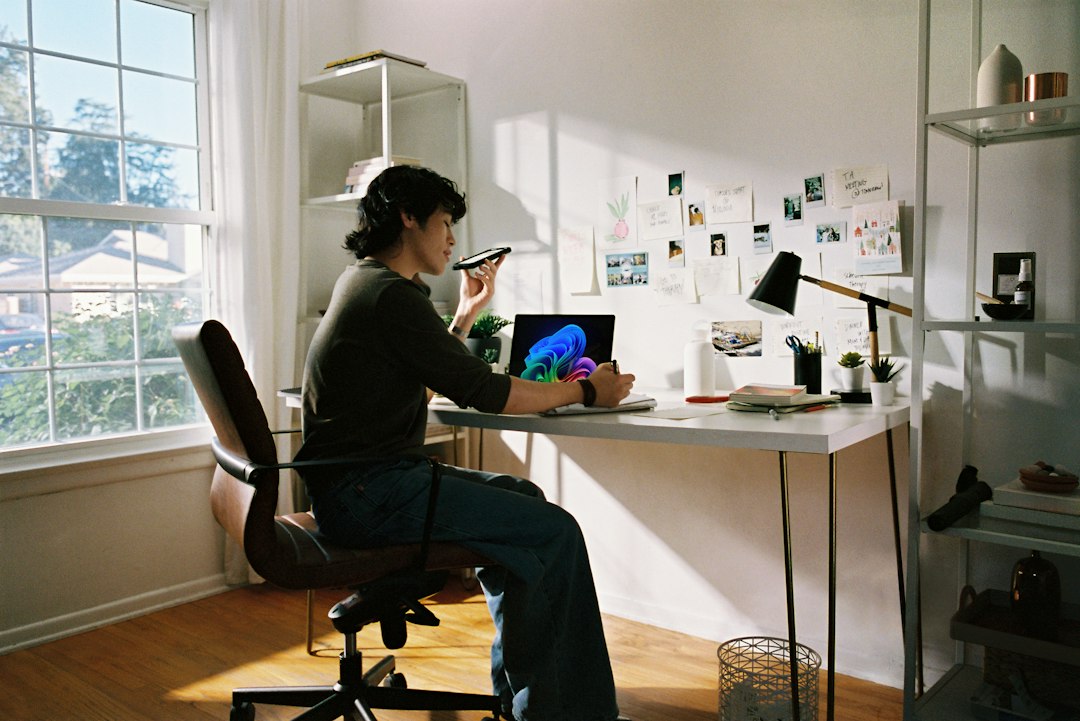Laptop at a desk where the Teams app cache is being reset